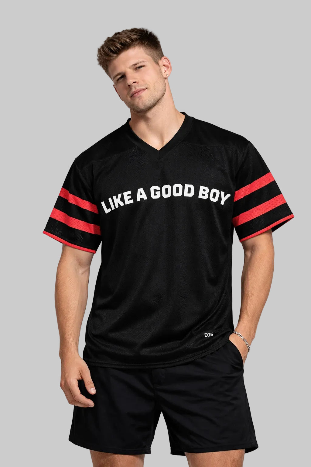 Man wearing a black sports outfit with 'LIKE A GOOD BOY' text on a white background